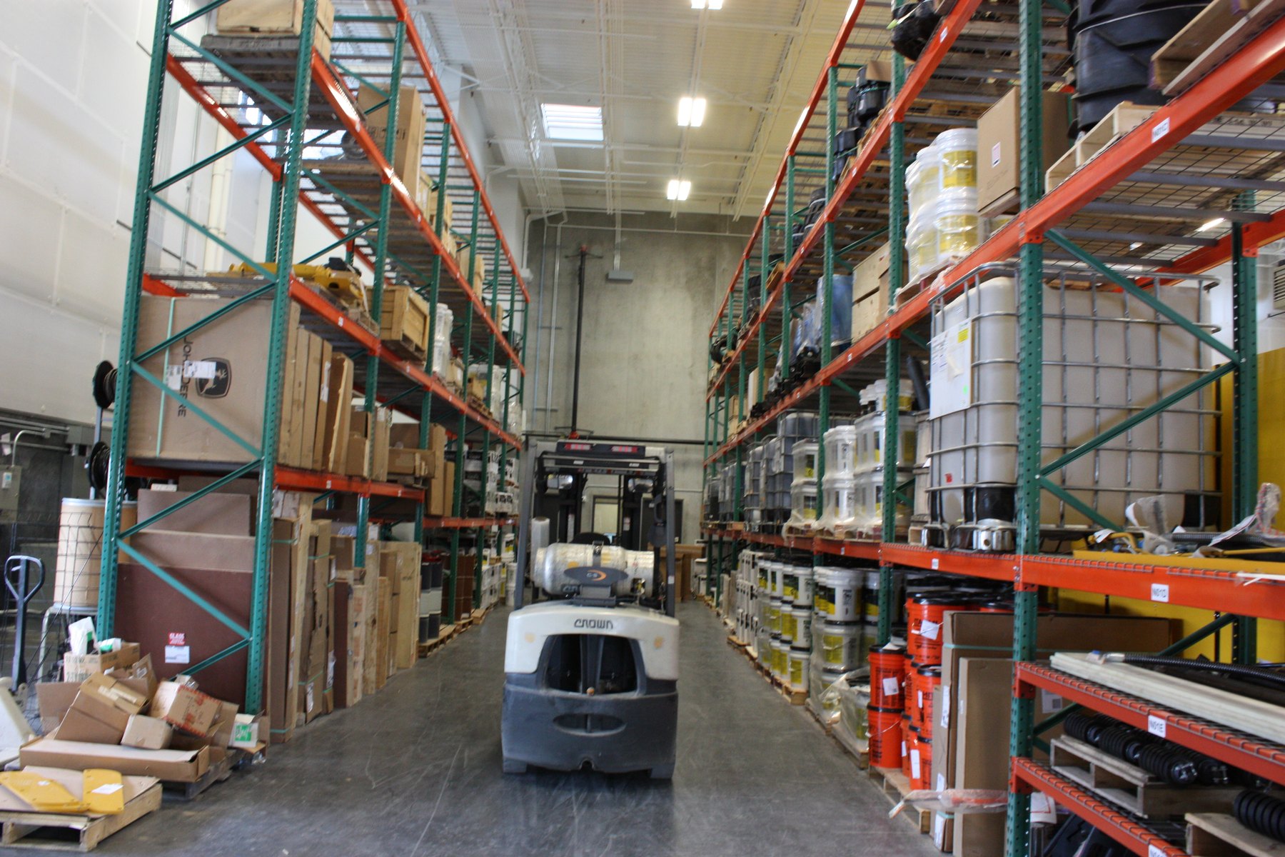 John Deere pallet rack storage aisle