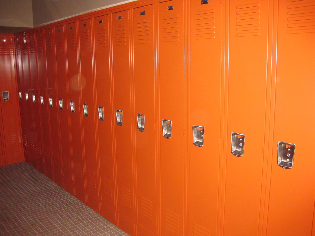 Long row of orange employee lockers installed for Metro Logics