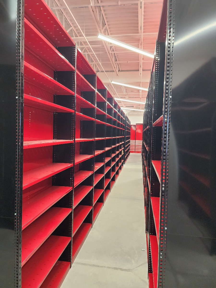 Side view of red and black boltless shelving